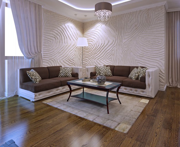 Pokój dzienny w stylu Art Deco. Panele podłogowe, skórzane sofy, dekoracyjna lampa i płytki ścienne.